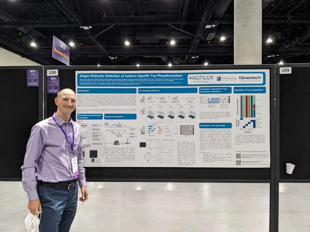 Photo of Nautilus' Associate Director of Applications Development presenting a poster at the Alzheimer's Association International Conference (AAIC)