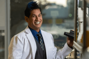 Parag Mallick smiling in the lab