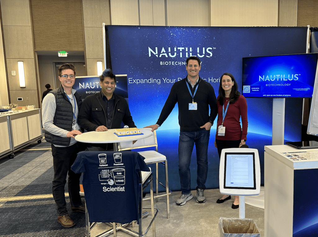 Nautilus employees at the Nautilus booth at US HUPO 2024